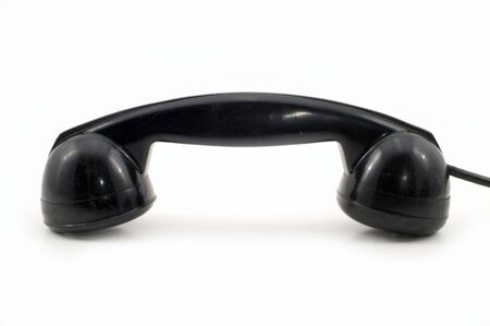 The old telephone of black colour on a white background.の写真素材