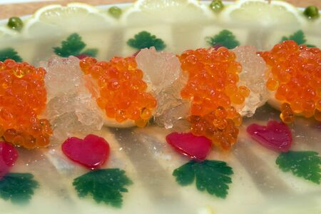 Fish jellied with red caviar.