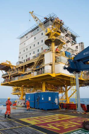 supply boat waitting for lift cargoのeditorial素材