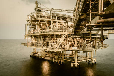 Oil platform  in the sea process retro style