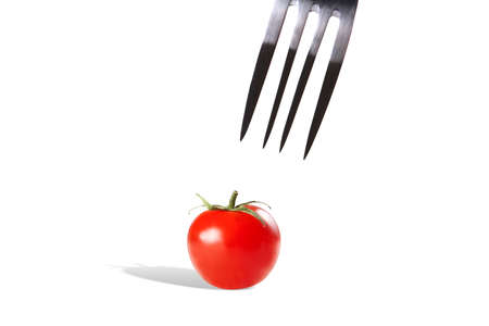 Fork with red Fresh tomato  Ready to eatの写真素材