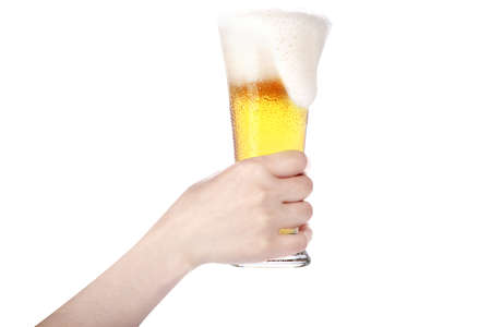 hand holding glass of beer isolated on a white background.making toastの写真素材