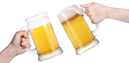 Frosty glass of beer with hand making toast isolated on a white backgroundの写真素材