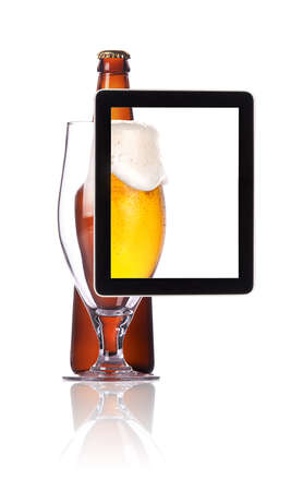  beer glass and bottle on tablet computear screen  isolated on a white backgroundの写真素材