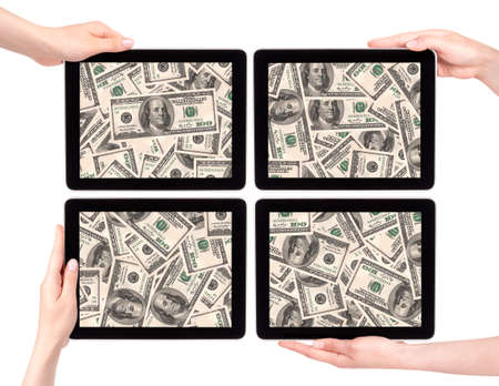 lot of money on a Tablet pc screen with woman hands isolated on a white backgroundの写真素材