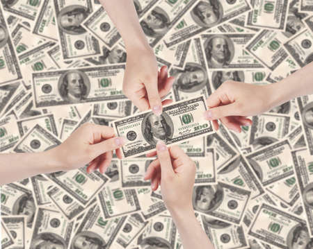 female hands with money with money backgroundの写真素材