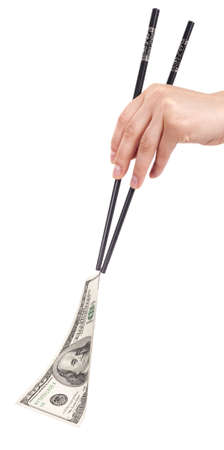 Chinese chopsticks holding money - american dollars isolated on a wjite backgroundの写真素材
