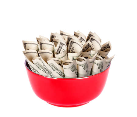 Concept image of food money - red plate full of american money isolatedの写真素材
