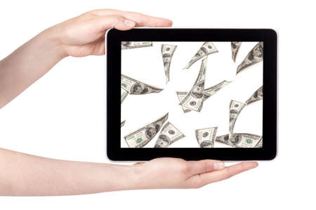lot of money on a Tablet pc screen with woman hands isolated on a white backgroundの写真素材