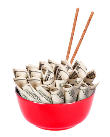 Concept image of food money - red plate full of money and Chinese chopsticks isolatedの写真素材