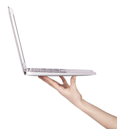 laptop with woman hand isolated on white backgroundの写真素材
