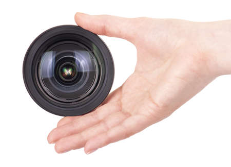  hand holding camera lens isolated on whiteの写真素材