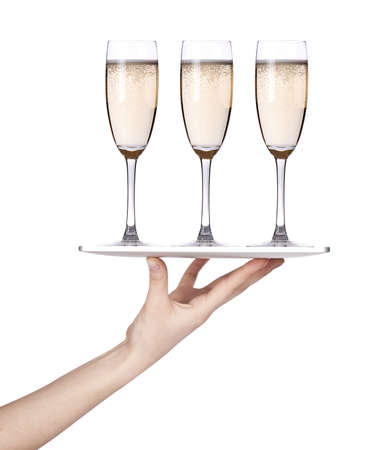 Waitresses hand holding a silver serving tray with champagne  isolatedの写真素材