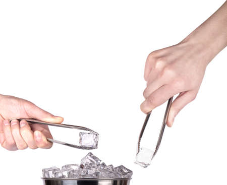 ice bucket  with hand holding Ice tongs isolated on a white backgroundの写真素材
