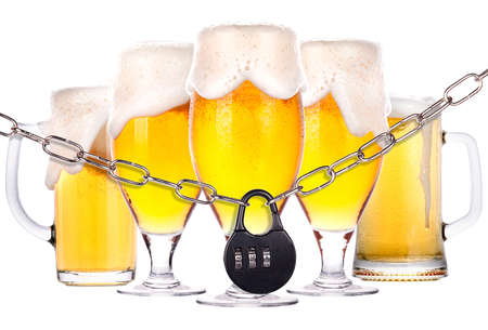 alcoholism concept - background with beer locked on a chain  isolatedの写真素材