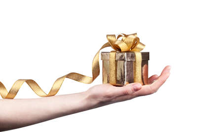 gift in woman hand isolated on white backgroundの写真素材