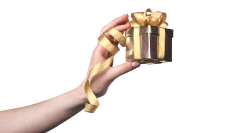 gift in woman hand isolated on white backgroundの写真素材