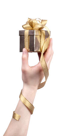 gift in woman hand isolated on white backgroundの写真素材