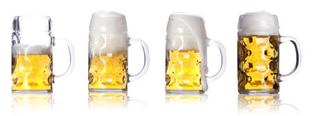 Frosty glass of light beer set  isolated on a white background の写真素材