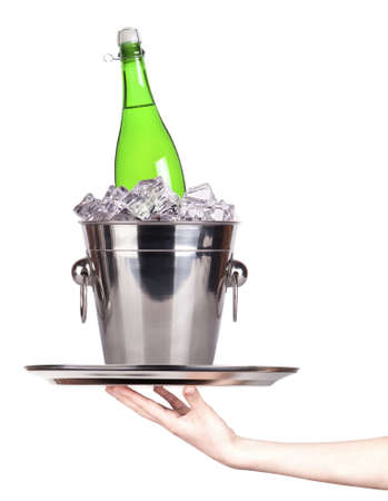 champagne on a silver tray with ice and hand isolatedの写真素材