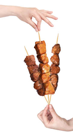 fresh grilled meat dishes with hand isolated on a white background