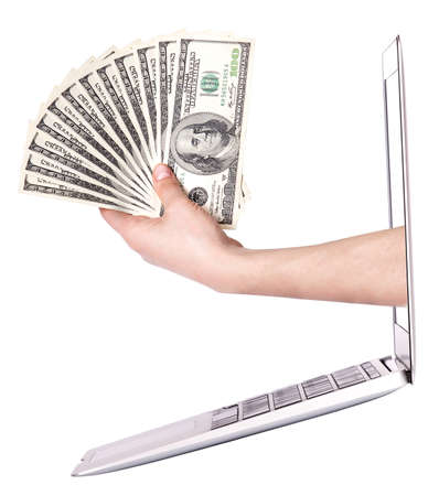 recive earnings concept - Human hand with money, coming out from  the computer screen isolatedの写真素材
