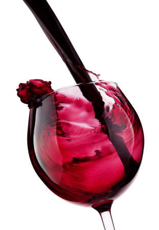 Glass with red wine splashの写真素材