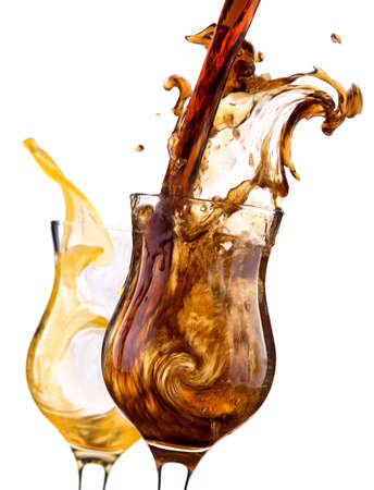 pair of Fresh cola drink background with splash isolated on a whiteの写真素材