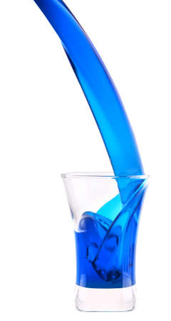 Blue Curacao shot cocktail splash isolated on whiteの写真素材