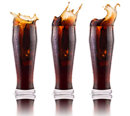 Fresh coke background with ice and splash isolated on a whiteの写真素材