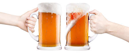 beer with man and woman hand making toast isolated on a white backgroundの写真素材