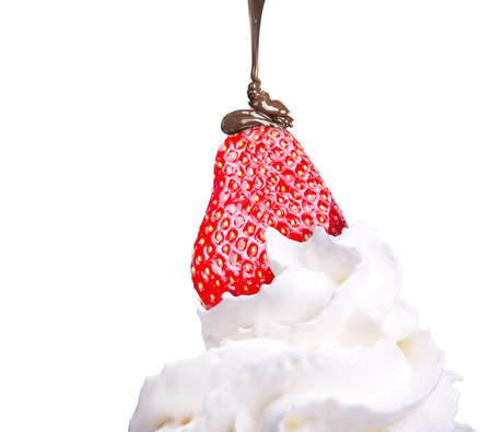 Whipped cream with tasty strawberry and chocolate isolated backgroundの写真素材