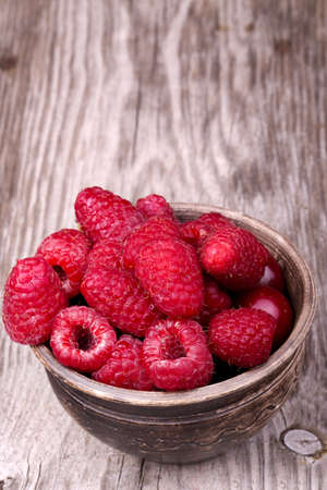 A beautiful selection of freshly picked ripe red raspberries.