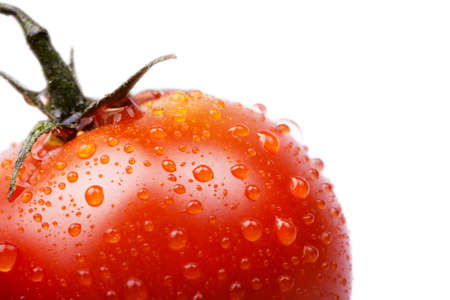 cherry tomatoes on a white macro background with water dropsの写真素材