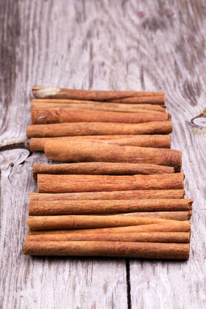 Different spices, Cinnamon, anise on wooden old tableの写真素材