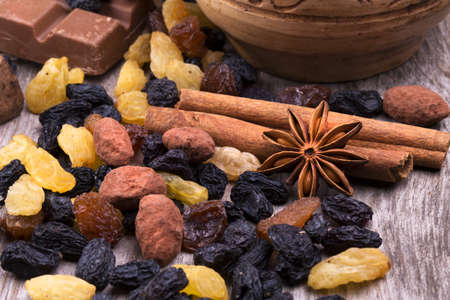Chocolate bar and spices on wooden table. Selective focusの写真素材