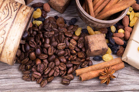 Chocolate bar and spices on wooden table. Selective focusの写真素材