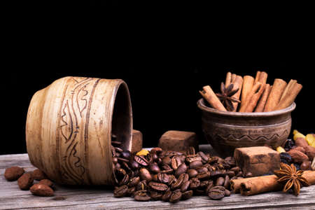 Chocolate bar and spices on wooden table. Selective focusの写真素材