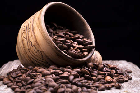 Closeup of coffee beans. Coffee bean on macro ground coffee background. Arabic coffee - ingredient of hot beverage.の写真素材