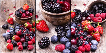  tasty summer fruits on a wooden table. Cherry, Blue berries,  strawberry, raspberries, Blackberries, pomegranateの写真素材