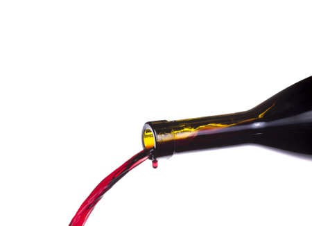 Splash red wine  against a white backgroundの写真素材