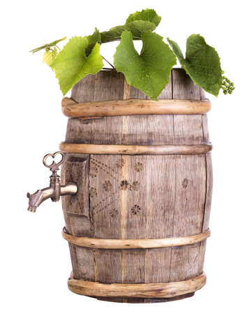 Ripe grapes on a wooden vintage barrel  isolated on a white backgroundの写真素材