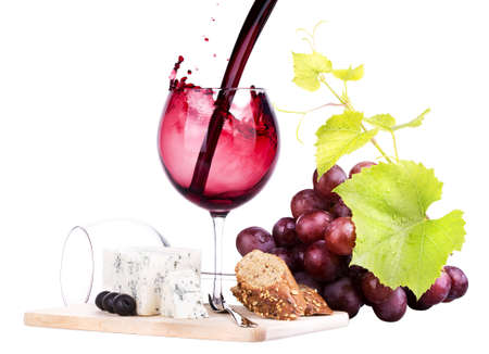 bottles and glasses of wine, assortment of grapes and cheese isolated on whiteの写真素材