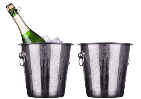 bottle of champagne in ice bucket and emptyの写真素材