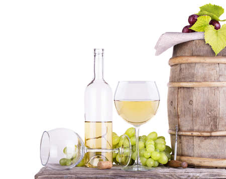 grapes on a barrel with corkscrew and wine glassの写真素材