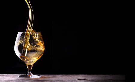 Cognac or brandy on a wooden tableの写真素材