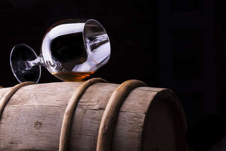 Cognac or brandy on a wooden barrelの写真素材
