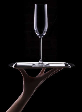 empty glass of champagne on black background