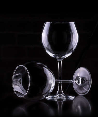 empty wine glass in black backgroundの写真素材