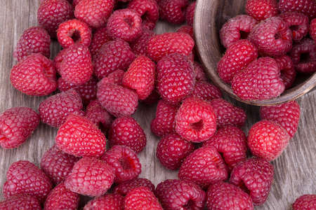 Sweet raspberry on wooden tables